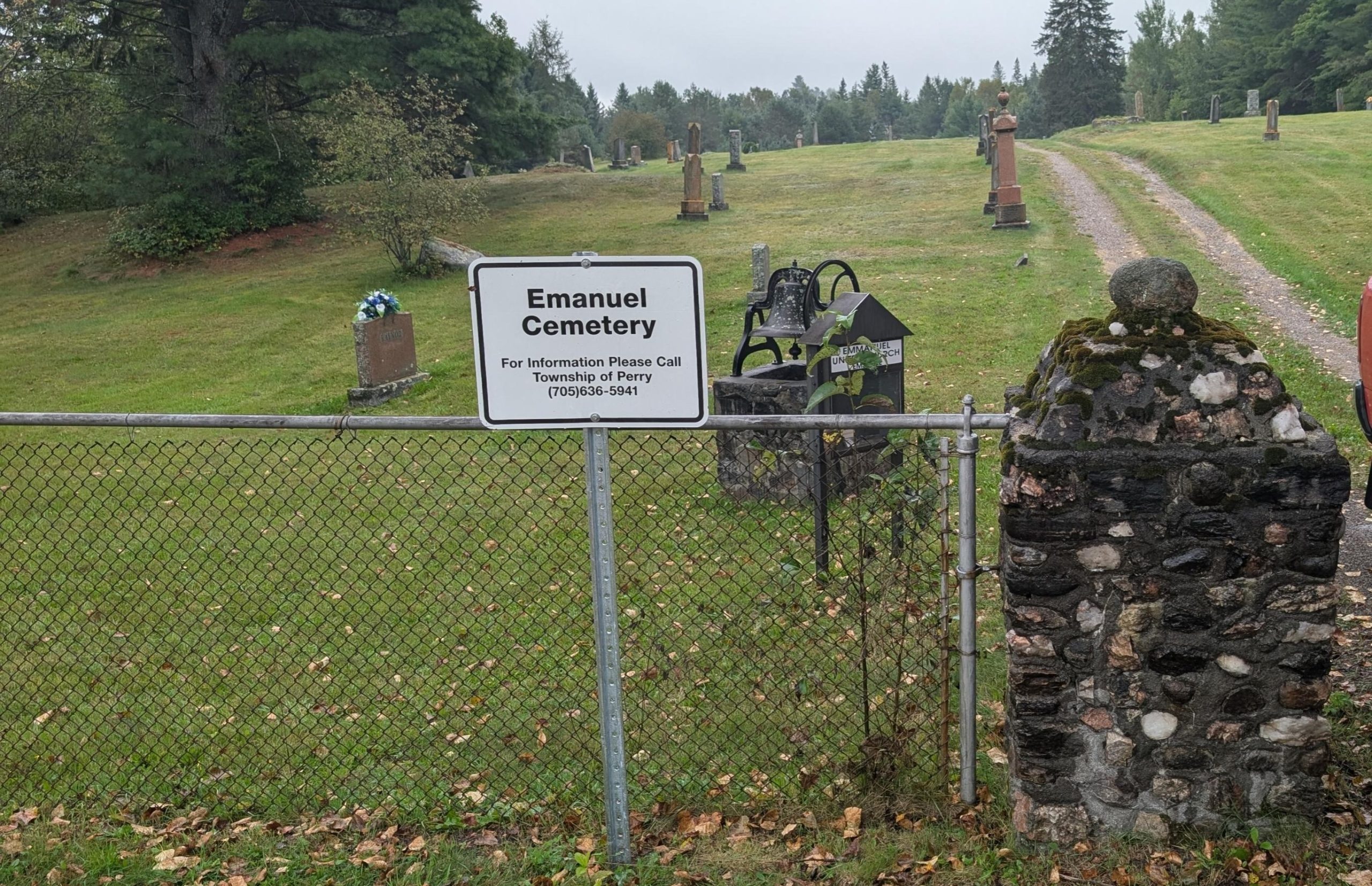 Cemetery with sign written Emsdale United Church cemetery